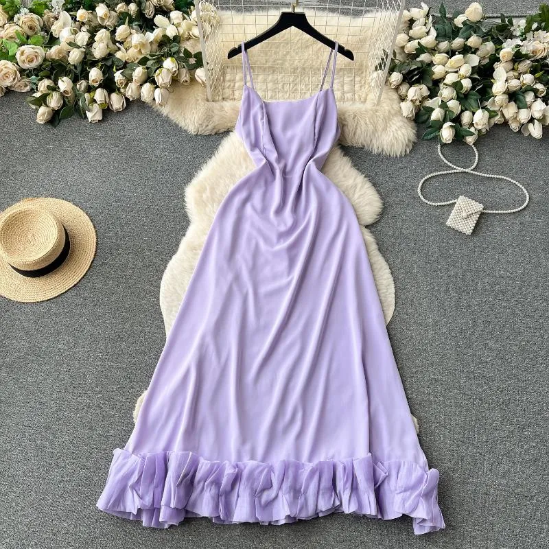 Vestidos casuales Clothland Mujeres Sexy Vestido de correa con volantes Cremallera Correas ajustables Sin mangas Sin espalda Una pieza Maxi Vestido QC943