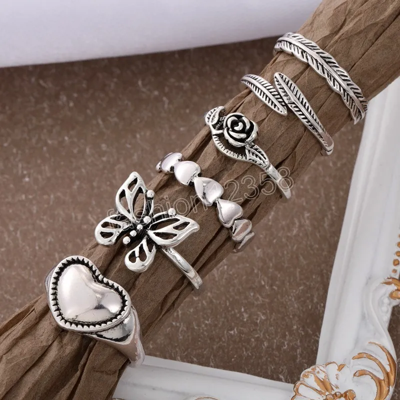 Set di anelli a farfalla vintage a forma di cuore cavo le donne Anello a forma di spirale geometrica color argento in metallo 6 pezzi Set di gioielli alla moda