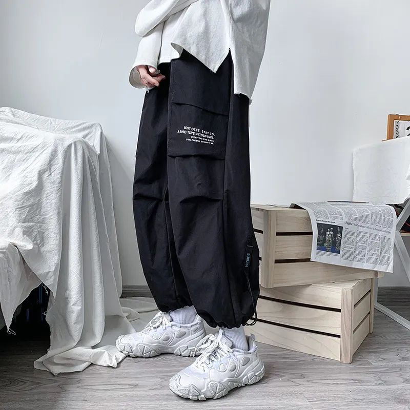 Męskie spodnie Czarne spodnie ładunkowe Męskie ubranie uliczne Hip Hop Hip Hougong Hougong Spodni męskie presie sportowe Męskie Pantie Męskie 5xl 230410