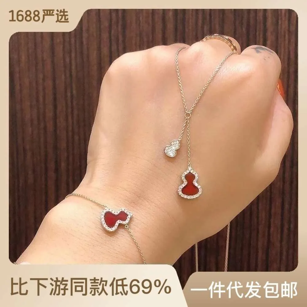 Nuova collana in stile cinese elegante e tempestata di orecchini a catena con clavicola e pendente in agata rossa con diamanti e nappe di zucca
