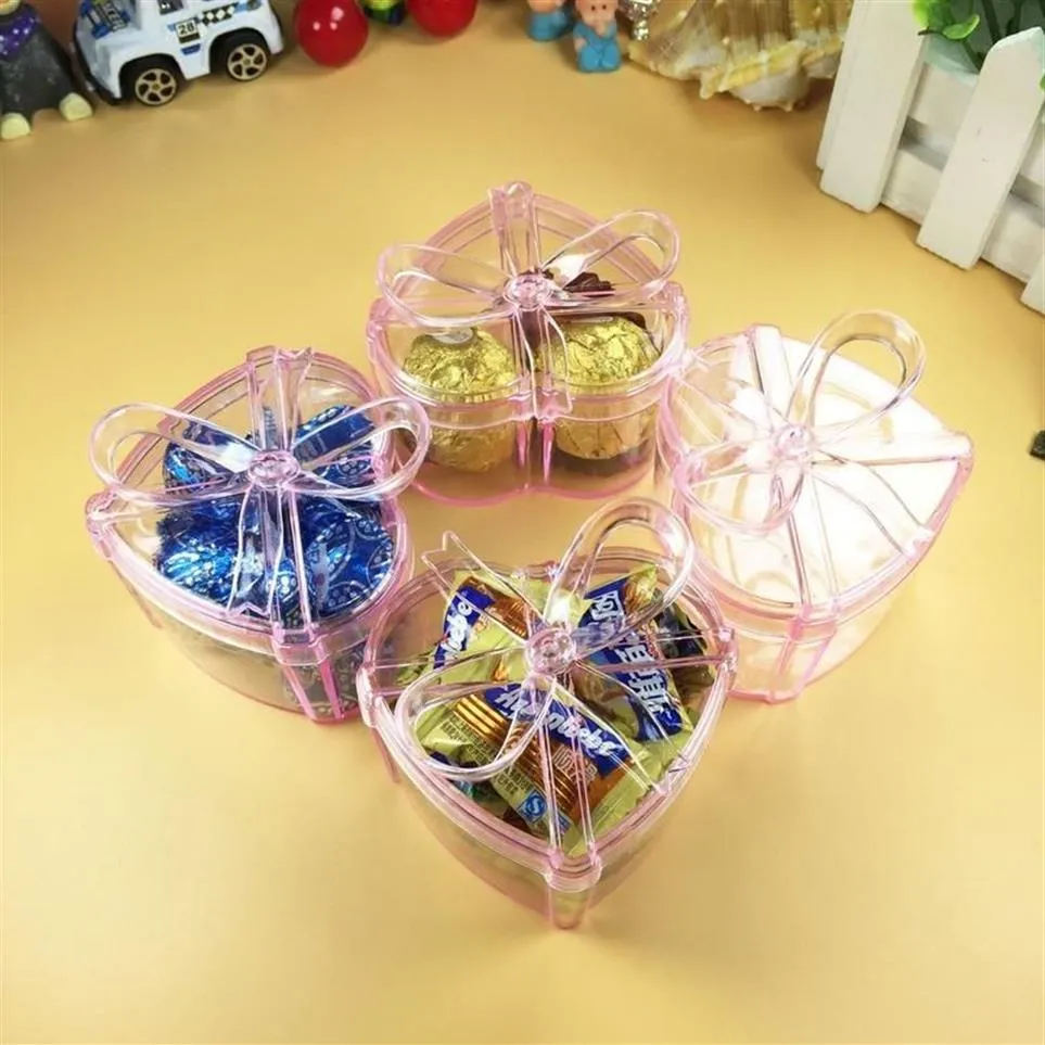Cadeau cadeau 4 pcs / set belle forme de coeur bowknot boîte de bonbons en plastique transparent pour la décoration de fête de mariage d'anniversaire fournitures276i