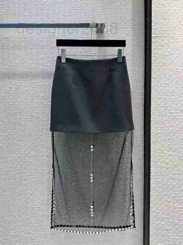 Designer de saias 23 Primavera/verão French Hepburn Style Diamond Craved Mesh malha de retalhos de retalhos de cintura alta saia dividida NF6T
