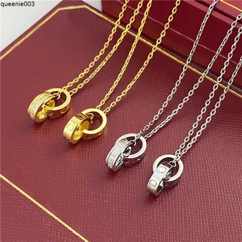 Pendentif Colliers Couker Femmes Femme Amour Bijoux Double Bague En Acier Inoxydable Bijoux Mode Ovale Anneaux De Verrouillage Claviculaire Chaîne Designer 0qpm