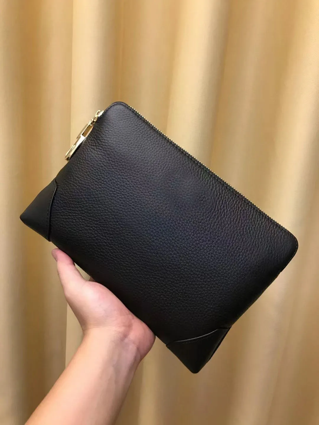 Designer leather 2025 clutch