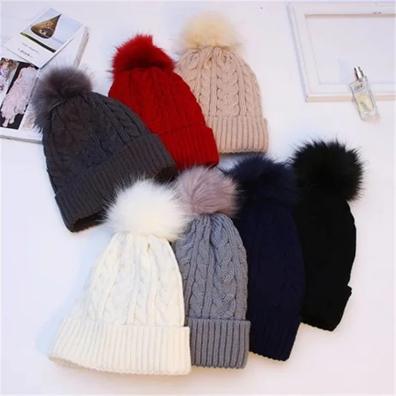 Wholesale custom knitted beanie warm fleece lining women cap cable faux fur pompom winter hat DF318