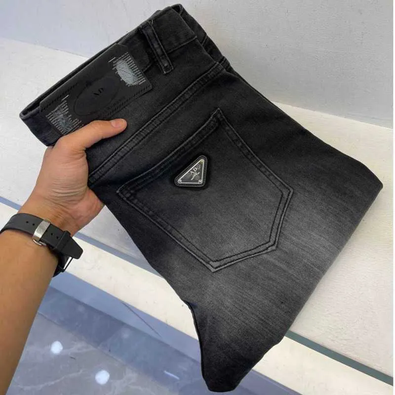 Herr jeans designer jean pants mode triangel denim byxor män kvinnor smala sträcka affärer små fötter slacks 2k9h