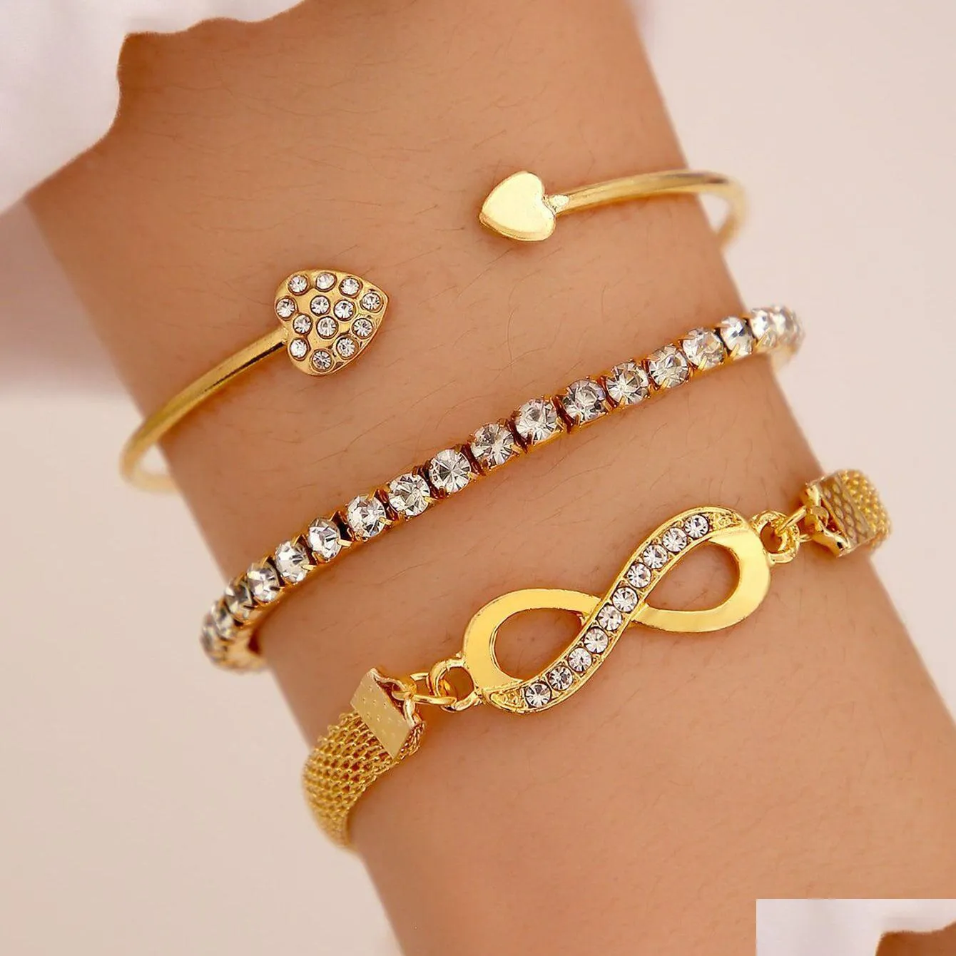 Bracelets de charme Strass Infinity Bracelet Hommes Femmes Bijoux Élégant Charme Bijoux Ensemble Pour Femmes Fille Vbr146 Drop Livraison Je Dhcrl