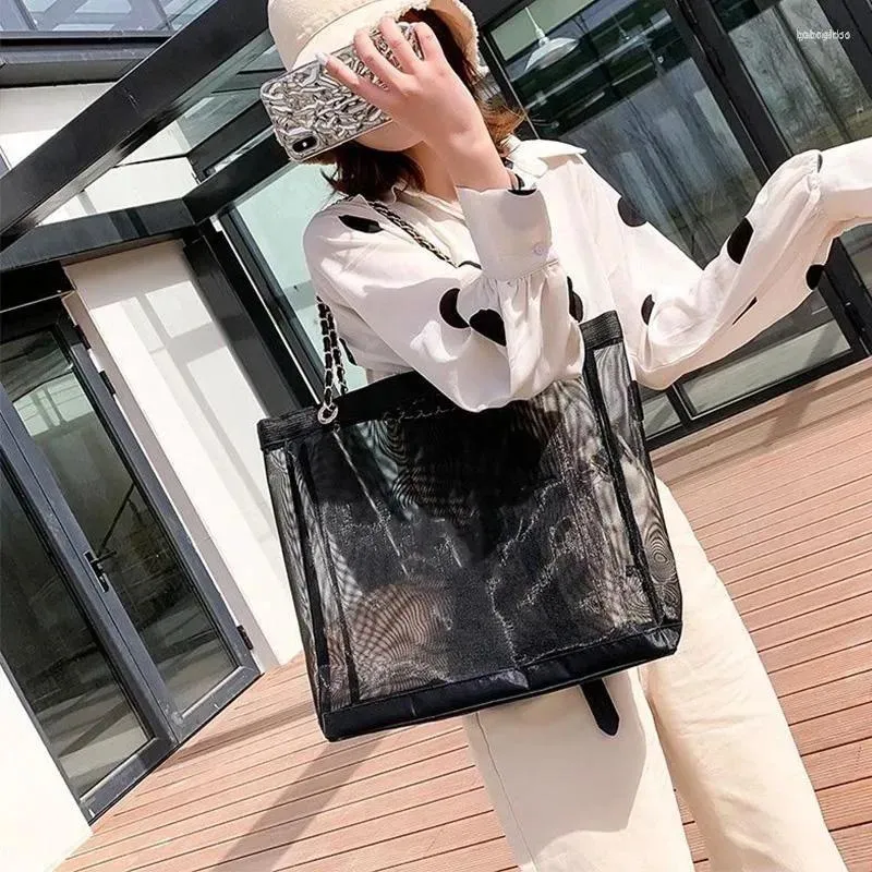 Förvaringspåsar lyxig design mesh väska transparent strand tote stor sommar shopping berömd designer kapacitet axel hand väska