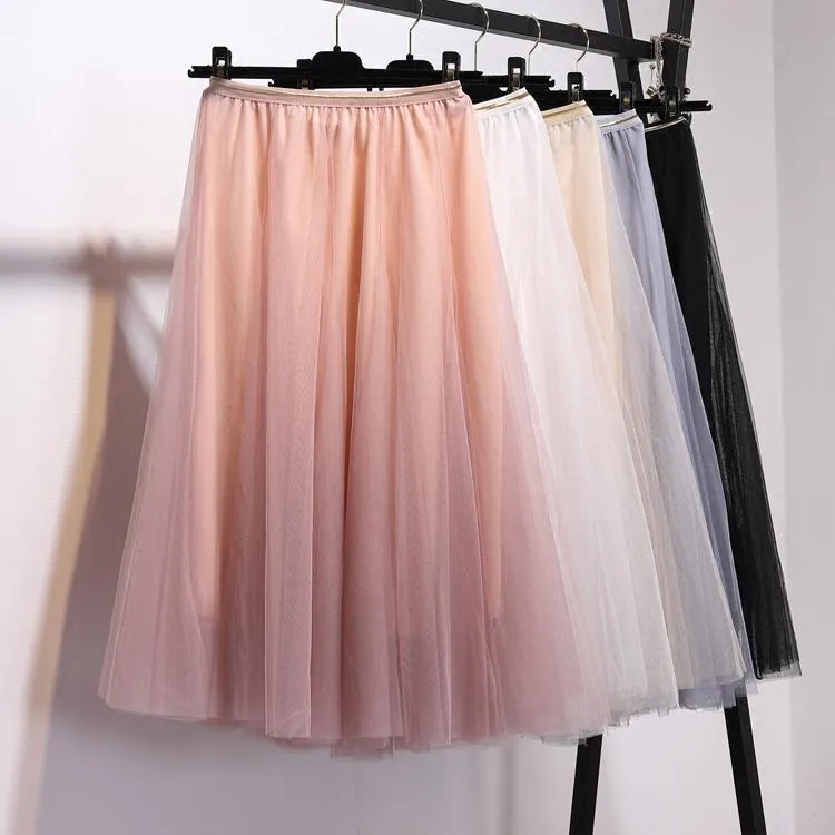 Skirts Net Yarn tiene una falda de gasa casi blanca con la cintura alta de la cintura hada hada larga plisado otoño invierno