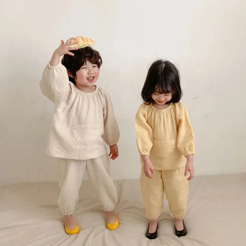 パジャマ春夏の子供の女の子のキャンディーカラーパジャマセット。toddlerキッドポケットパジャマセットフラワーズホームスリープウェア。