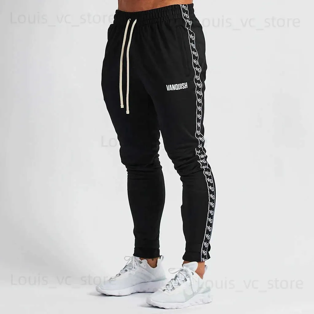 Pantaloni da uomo Pantaloni sportivi da fitness Pantaloni da allenamento sportivi da corsa larghi da uomo 2023 Tirare la corda Lettera Striscia di bordo T231118