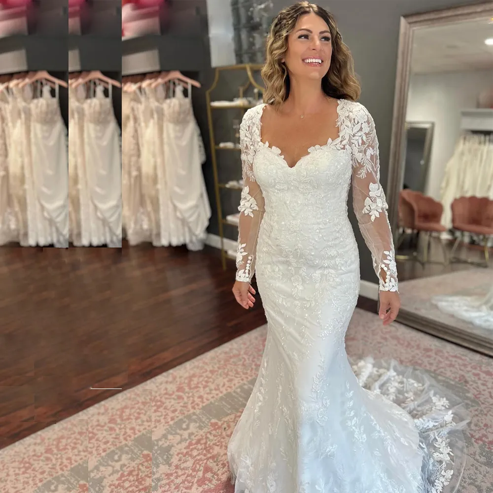 Abiti da sposa a sirena in pizzo con applicazioni di paillettes Abito da sposa senza schienale con scollo a cuore per abiti da sposa a sirena a maniche lunghe da donna