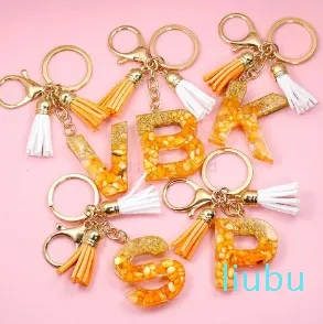 Oranger Anfangsbuchstaben-Schlüsselanhänger mit doppelter Quaste, bunter Steinfüllung, Kunstharz, englischer Buchstabe, Schlüsselanhänger, Taschenanhänger