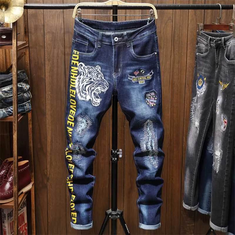 Mäns jeans designer rock jeans väckelse tiger huvud broderi personlig blå bokstav tryck denim byxor trend wkpx