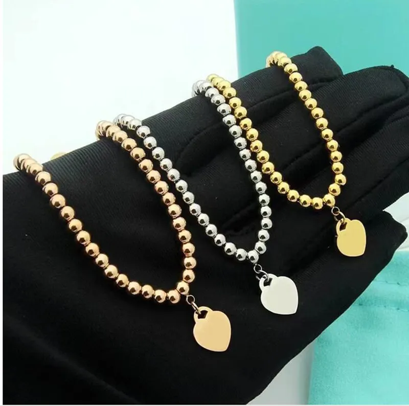 Collana con ciondolo alla moda da donna in acciaio inossidabile con perline rotonde in oro argento con perline collane elastiche con ciondolo a forma di cuore