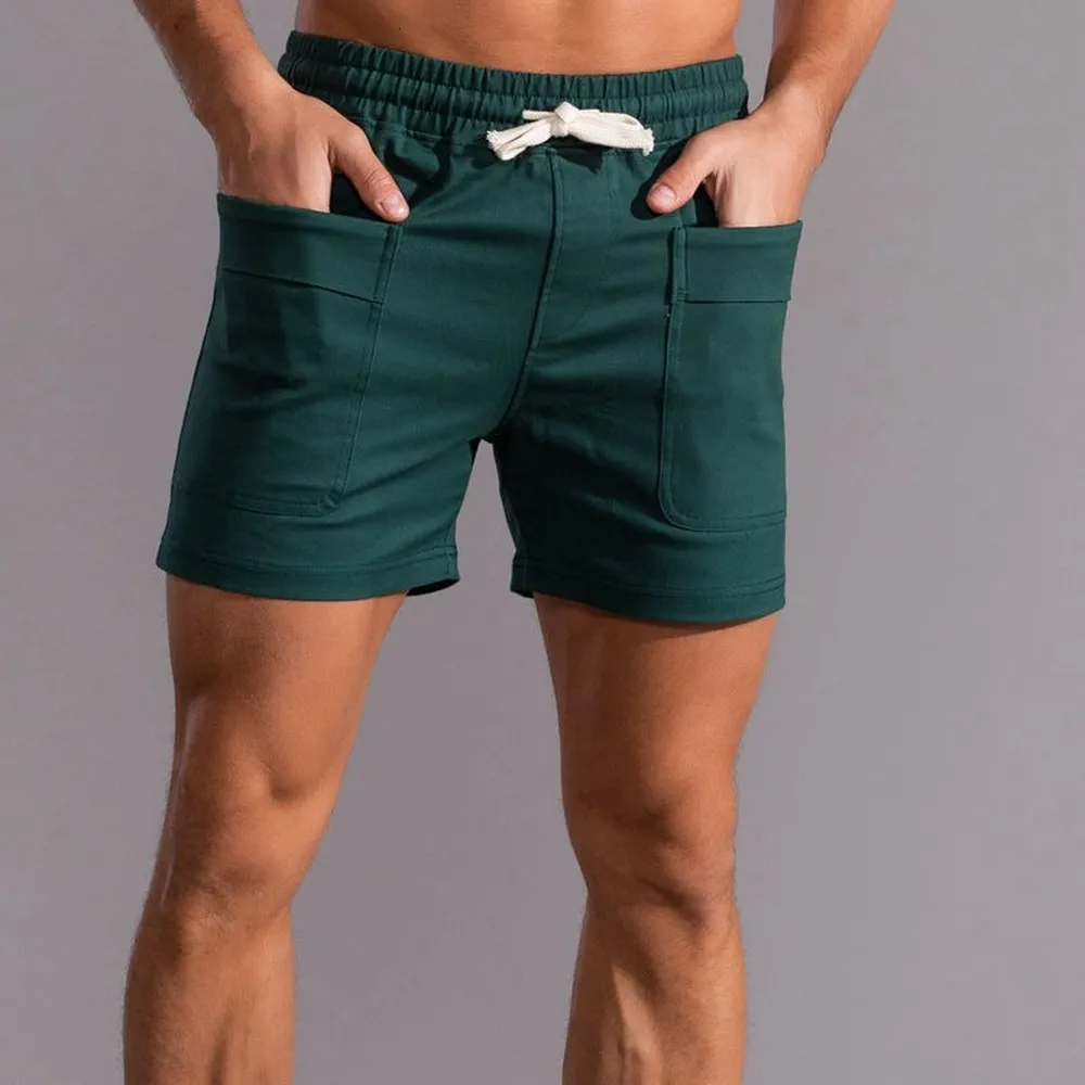Shorts masculinos shorts shorts homens com bolsos dianteiros homens shorts gináste fitness use shorts de suor de algodão puro homens moda moda sportswear Bottoms 230419