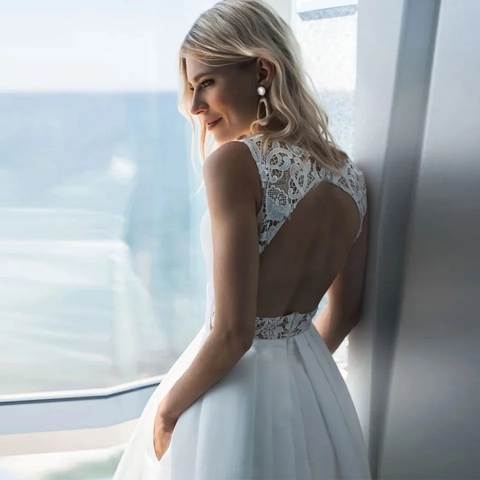 Satin Tea Length Wedding Dress With Pockets Lace Appliques V-Neck Sleeveless Backless Empire Waist White from Dhgate A-Line Wedding Dresses - price 139.9 Satin Tea Length Wedding Dress With Pockets Lace Appliques V-Neck Sleeveless Backless Empire Waist White from Dhgate A-Line Wedding Dresses - price 139.9