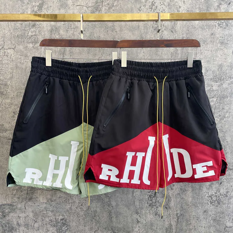 Ropa de diseñador Rhude Letter Trend Marca Empalme de dos colores Pantalones cortos a juego Pantalones de cinco puntos Estilo masculino High Street Ocio Parejas Joggers Ropa deportiva