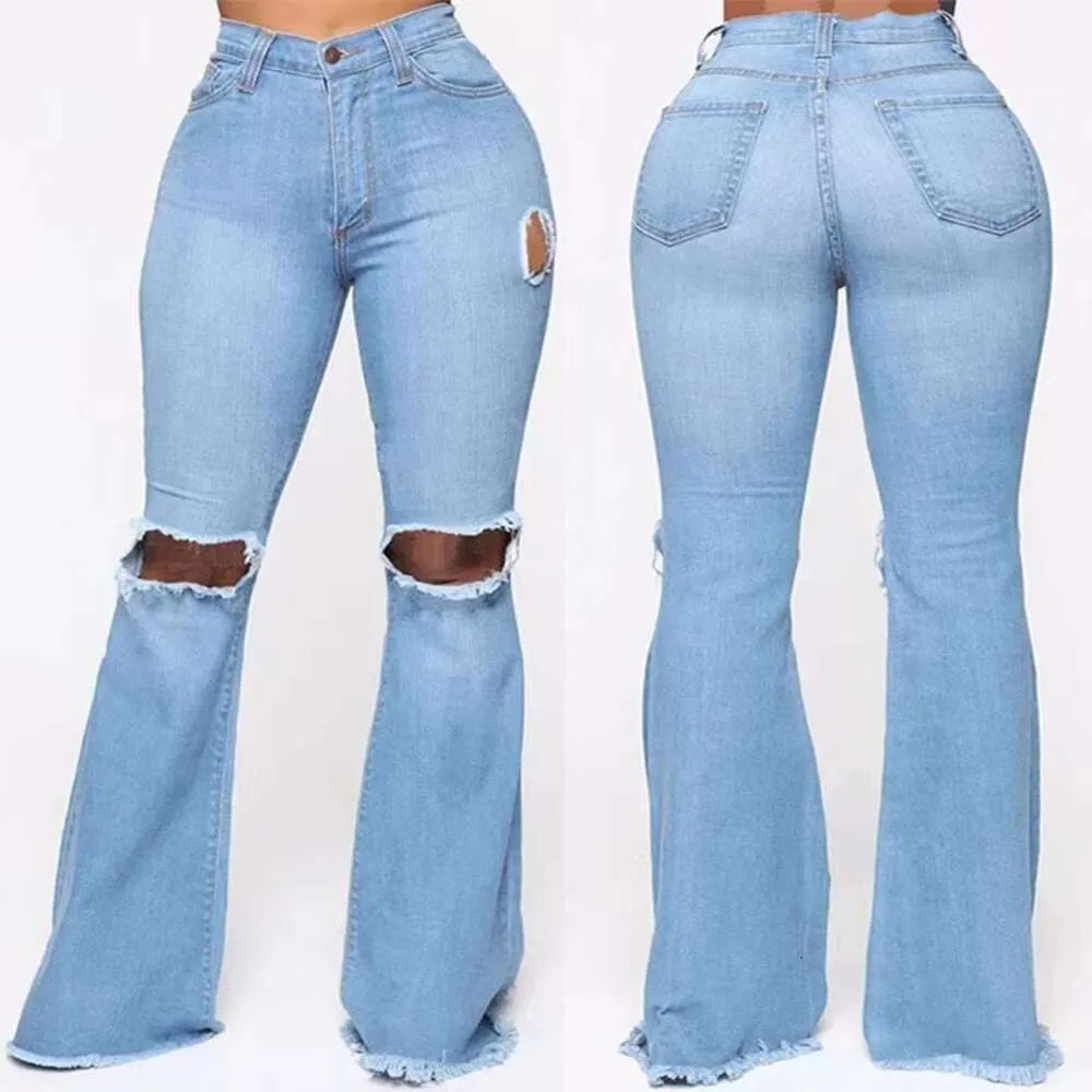 女性のジーンズS-xxxlは、穴のある女性のためにリッピングされたハイウエストビンテージフレアタッセルベルボトムジャンデニムズボン卸売ブランドデザイナー