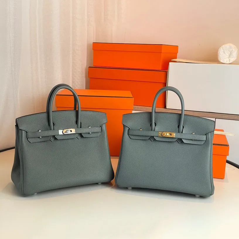 Luxury Top Handle Bag Black Purse äkta läderdesigner Clutch Bag Womens Men Crossbody Tote Handväska Victoria Lock Pochettes Satchel Shoulder Bags