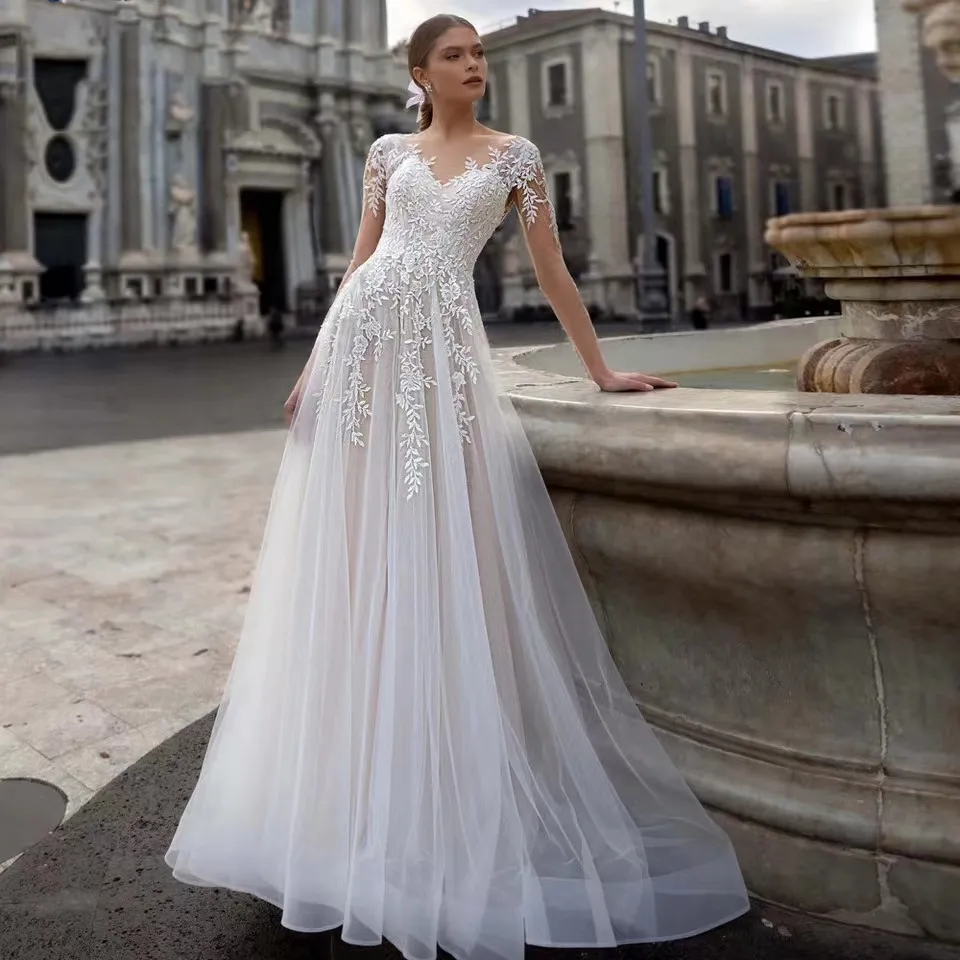 boho A-Line Abiti da sposa Africano Dubai Elegante maniche lunghe Girocollo trasparente Appliques in pizzo Vestios De Novia Abiti da sposa con bottoni Abito da sposa taglie forti