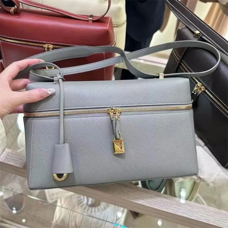 Designer handbag with lock and key sales