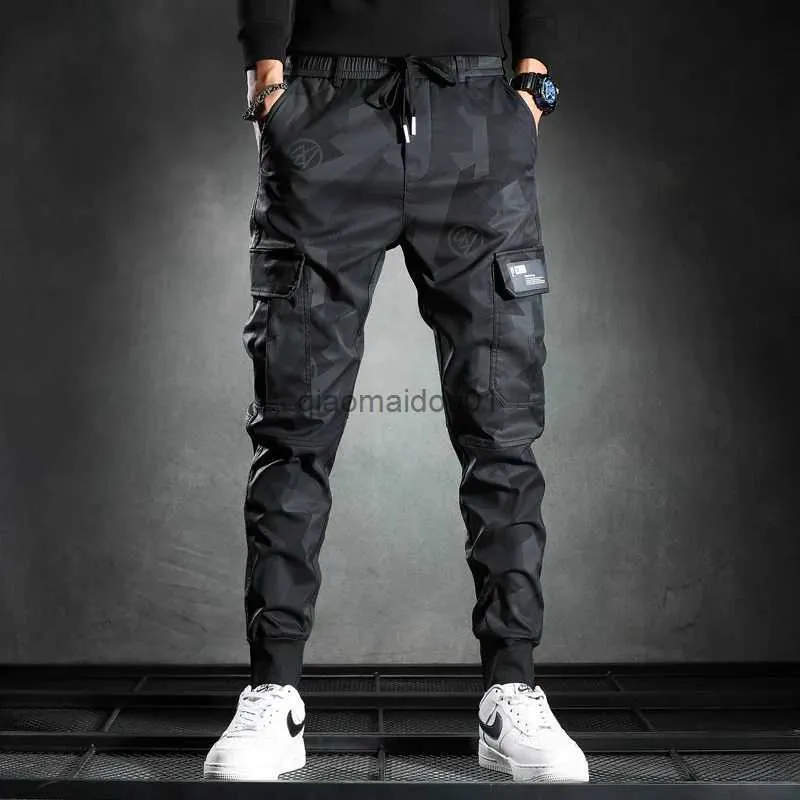 Pantalones para hombres Pantalones de chándal Hombres Camuflaje Elasticidad Pantalones de carga militares Cordón Multi bolsillos Fondos Casual Jogger Pantalones L231124