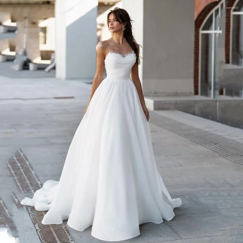 فستان زفاف رائع رقبة شفافة A-LINE فساتين بيضاء أورجانزا العروس ثوب 2023 اللؤلؤ