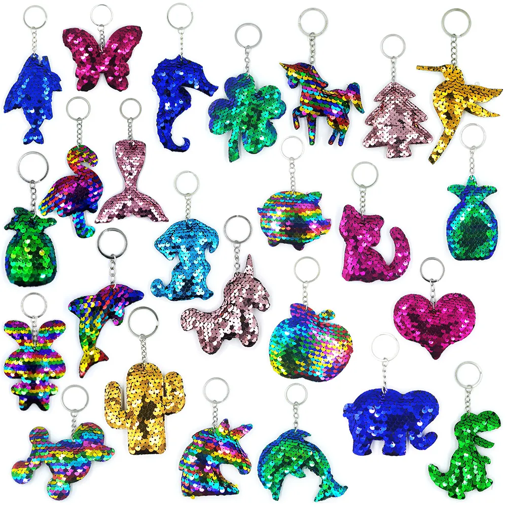 Multiple reflective and glossy keychain bags, pendants, unicorns, flamingos, dolphins, pineapples, hummingbirds, bears, five pointed star cats