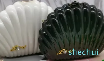 Shell kształt wieczorny akrylowy ramię