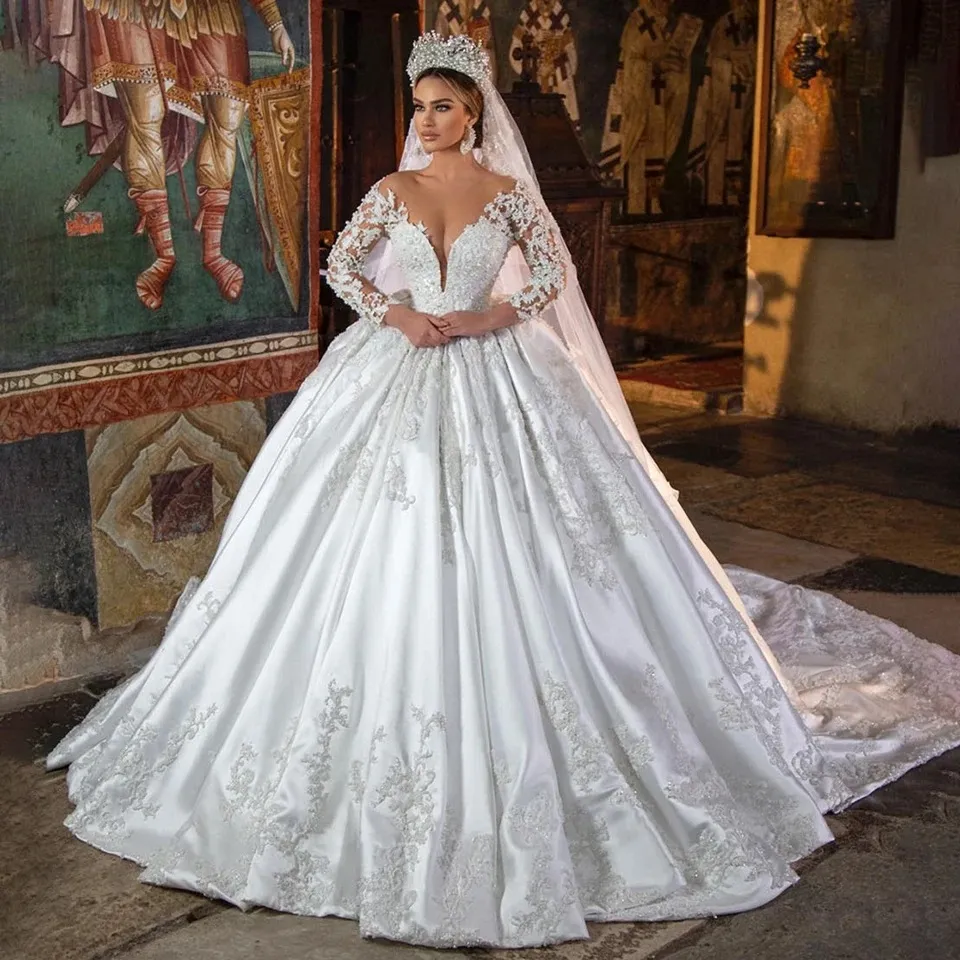 2024 Principessa di lusso Abito da ballo in raso Abito da sposa In pizzo Perle In rilievo Maniche lunghe Collo trasparente Abito da sposa bianco Vestido De Novia