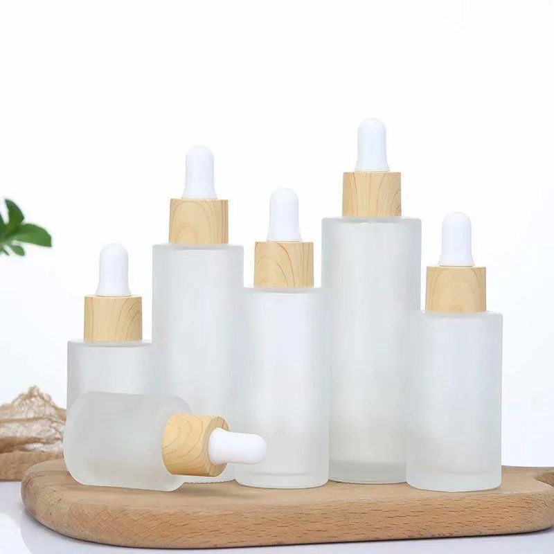 Flacon compte-gouttes en verre transparent givré, flacons d'emballage cosmétique de parfum d'huile essentielle avec couvercle en bois imité 20 ml 30 ml 50 ml 60 ml 100 ml Vjrbc