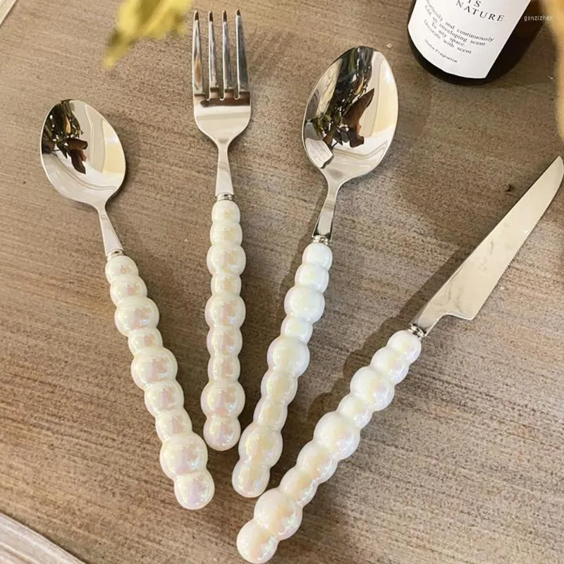 Set di stoviglie Europa Moda Set di posate di perle in acciaio inossidabile Creatività regalo Forchetta Manico da tavola Coltello in ceramica Posate Spo M0R7