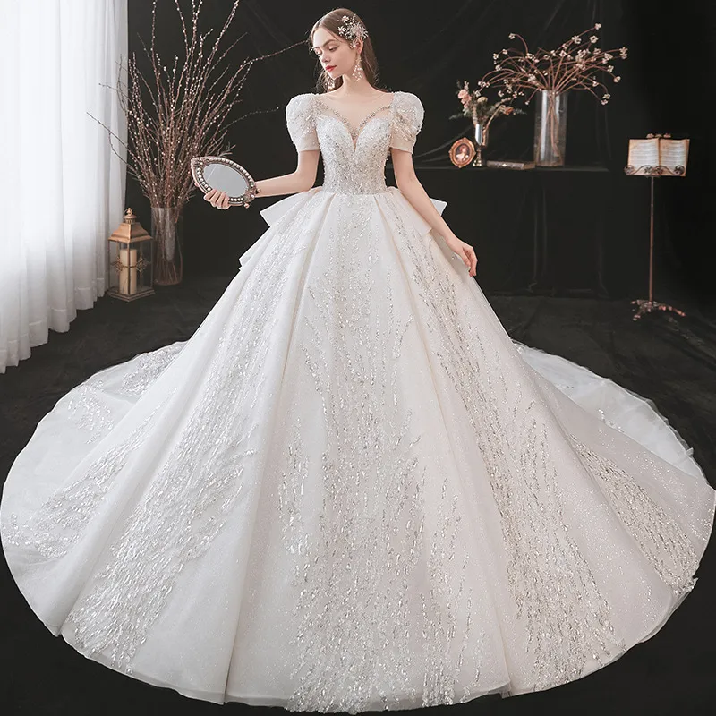 2023 Robe brillante de luxe Robes de bal Robes de mariée Nouvelle robe de princesse Corset Sweetheart Organza Volants Cathédrale Train Robe de mariée Plus Taille Robes de mariée sur mesure