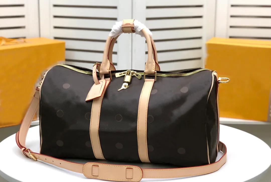Bolsa de viagem da moda Bolsa de luxo prática de couro de grande capacidade e designer de qualidade AAA mmm1414