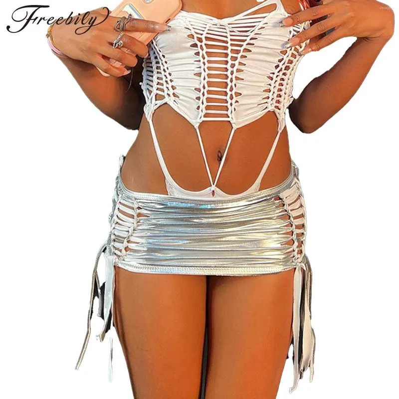Kjolar kvinnor sexig ihålig ut mager blyerts kjol metallisk glansig dragkammare snörning bodycon miniskirt för festmusikfestival klubbkläder