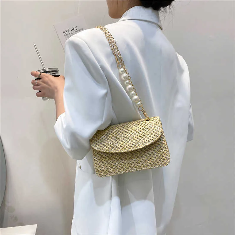 versione primavera ed estate nuova borsa a tracolla moda paglia intrecciata perla banchetto borsa a tracolla portatile borsa da donna