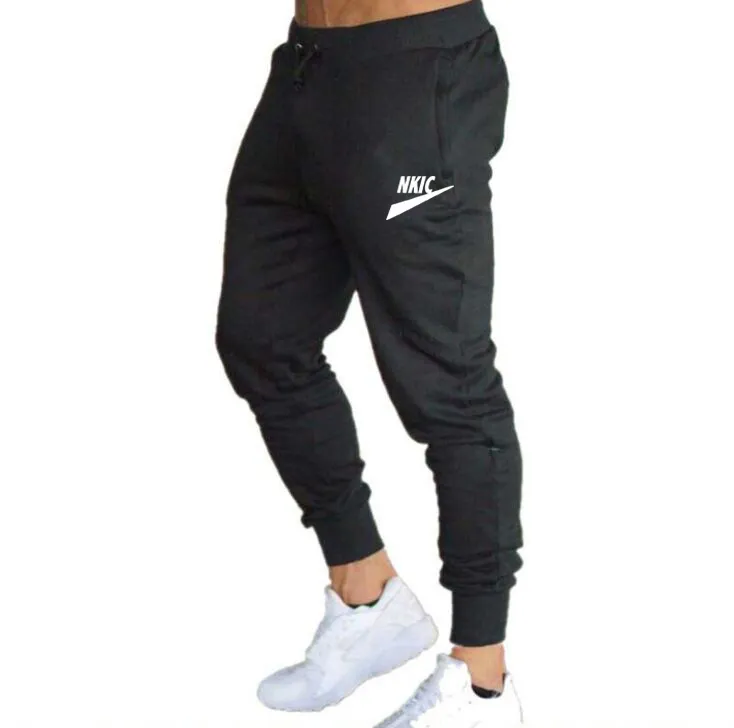 2023 marque décontracté pantalons maigres hommes Joggers Fitness entraînement hommes marque pantalon de survêtement nouveau automne mâle marque de mode LOGO imprimer