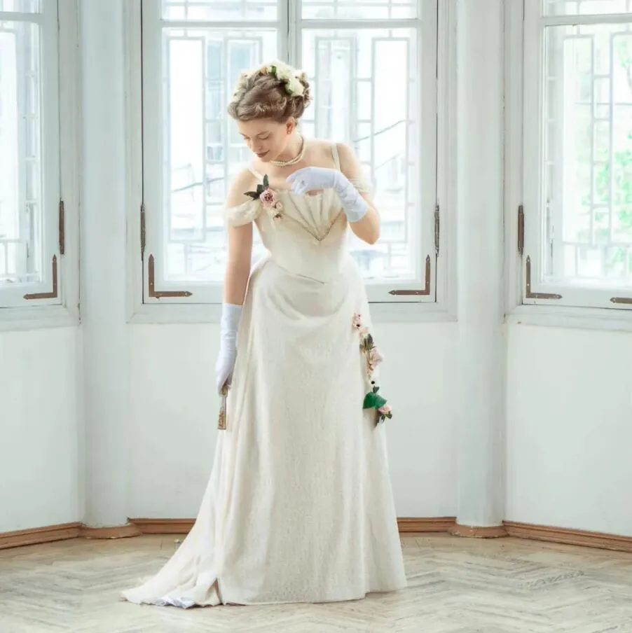 Victorian Beige A-line cold shoulder wedding dress with Pleats, Beaded Straps, Off-Shoulder Design, Lace-Up Corset, and Plus Size Options - Perfect Victorian Beige A-line cold shoulder wedding dress with Pleats, Beaded Straps, Off-Shoulder Design, Lace-Up Corset, and Plus Size Options - Perfect