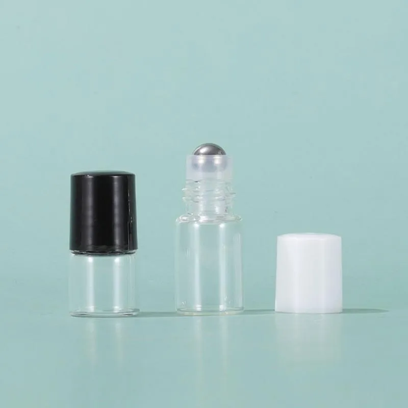 Bouteilles d'emballage en gros 1 ml 2 ml 3 ml 5 ml bouteille à roulettes en verre transparent avec bal en métal et couvercles noirs blancs