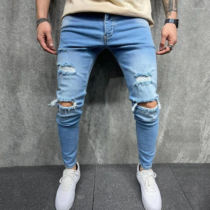 Jeans da uomo 2023 Primavera piedi piccoli Pantaloni azzurri con foro al ginocchio Pantaloni da uomo slim fit Tempo libero Streetwear Hip Hop Uomo