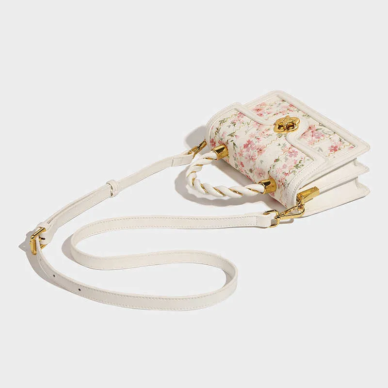 Schoudertassen klein ontwerp kanten gefrituurd deeghend pols handheld square voor vrouwelijke lente/zomer nieuw high -grade one crossbody