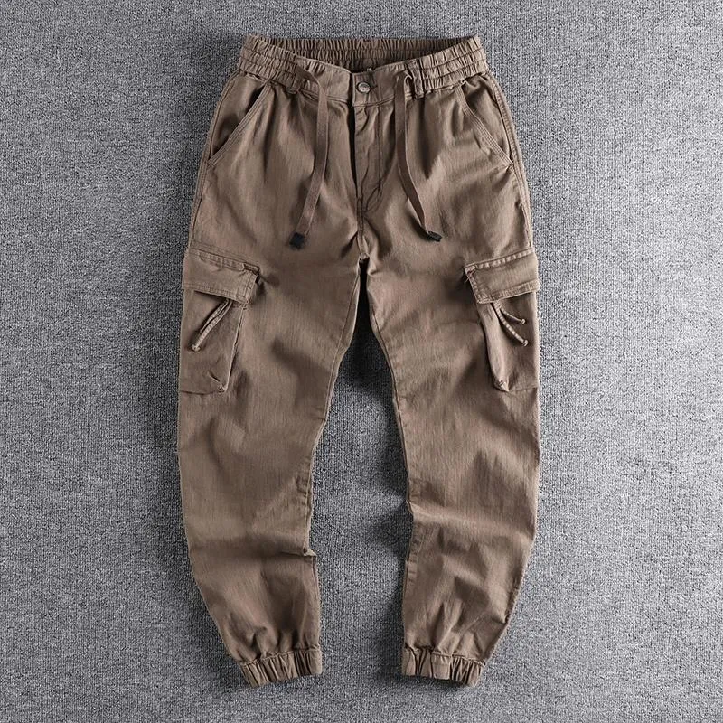 Pantaloni da uomo 2023 Abiti da lavoro in tessuto Pantaloni casual da uomo allentati Piccolo piede Tasca tridimensionale Versatile Leggings per giovani Pantaloni 315