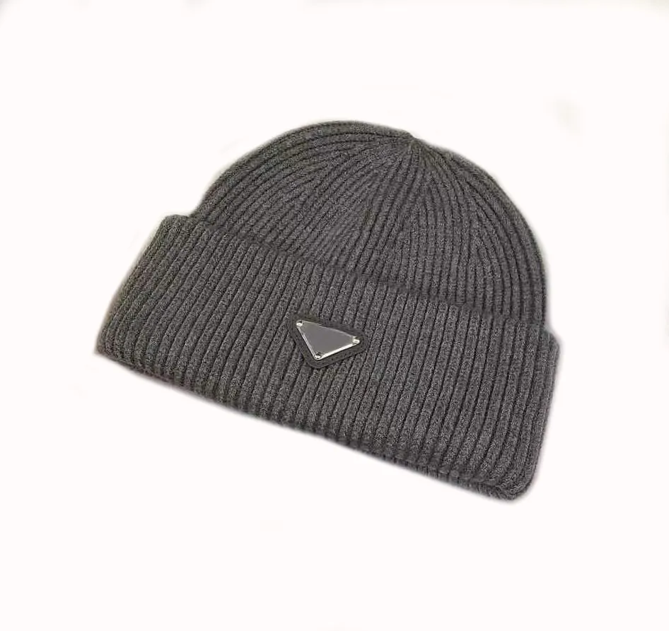 Winter designer caps luxury man hats creative metal triangle with letters cold wind proof warm delicate beanies modern designer knitted hat for ladies gentleman