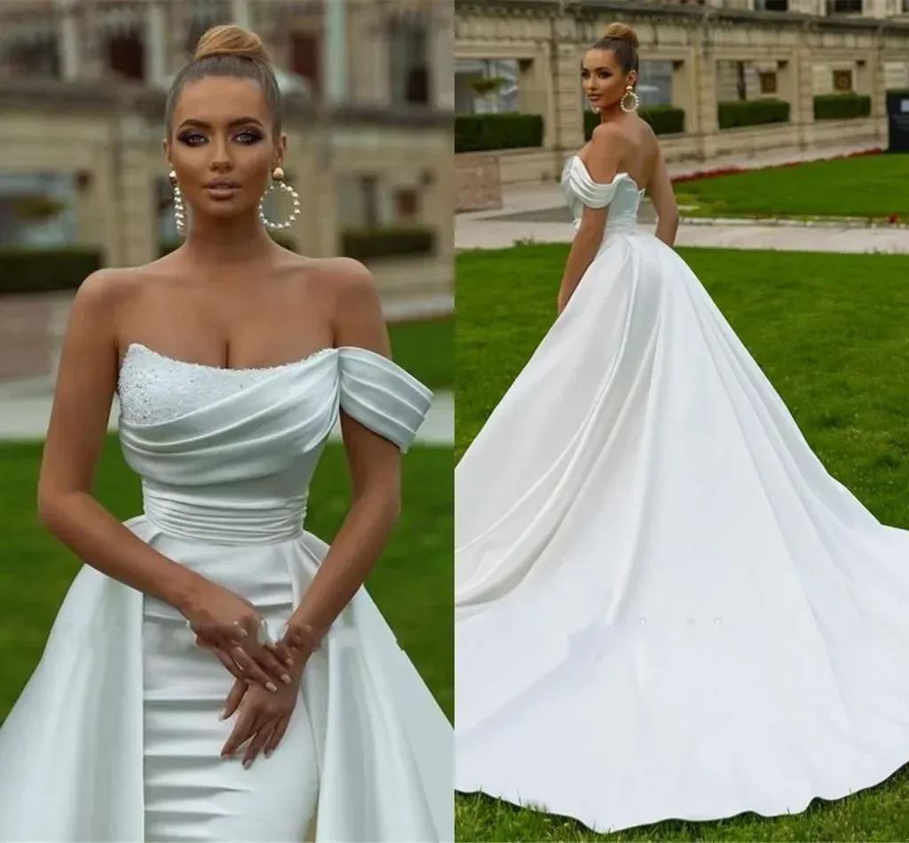 العربية المذهلة Aso ebi Dubi Dubai White Ivory Wedding Dresses Sexy Mermaid قبالة الكتف الترتر عاريات الخرزات الطائرات الكشكشة الطويلة أردية Bc15217