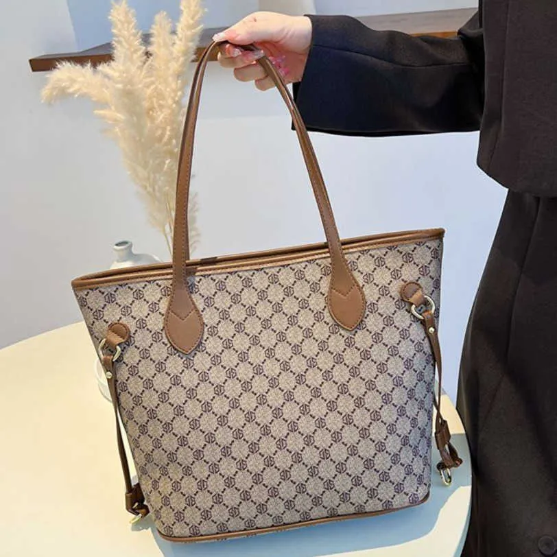 Bolso de mujer estampado con sensación avanzada y bolso grande de un hombro, bolsos grandes con cadena especial del Tíbet, venta de liquidación