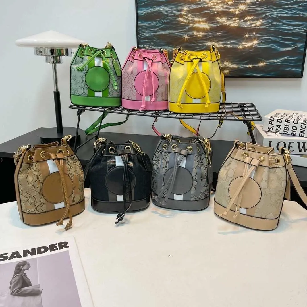 Bolsa de designer de luxo bolsa de bolsa de ombro de bolsa de ombro mini balde feminino feminino satchel drawcord 2023 novo estilo contraste de lona fábrica de ombro venda direta