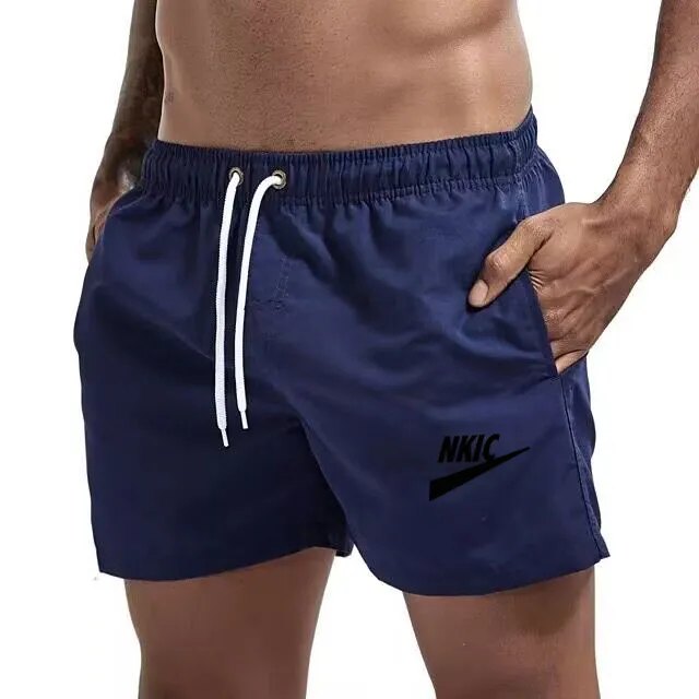 Mäns shorts solid sport avslappnad fitness andningsgymniga gym jogging träning träning lös man strandbyxor byxor