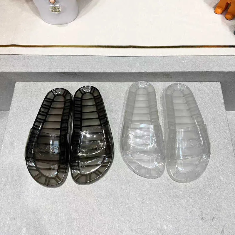 Slippare 2023 Design vår sommar Nya transparenta tofflor Fashion Plat Plastic Men's Women's Crystal Open-Toe Back tomma sandaler