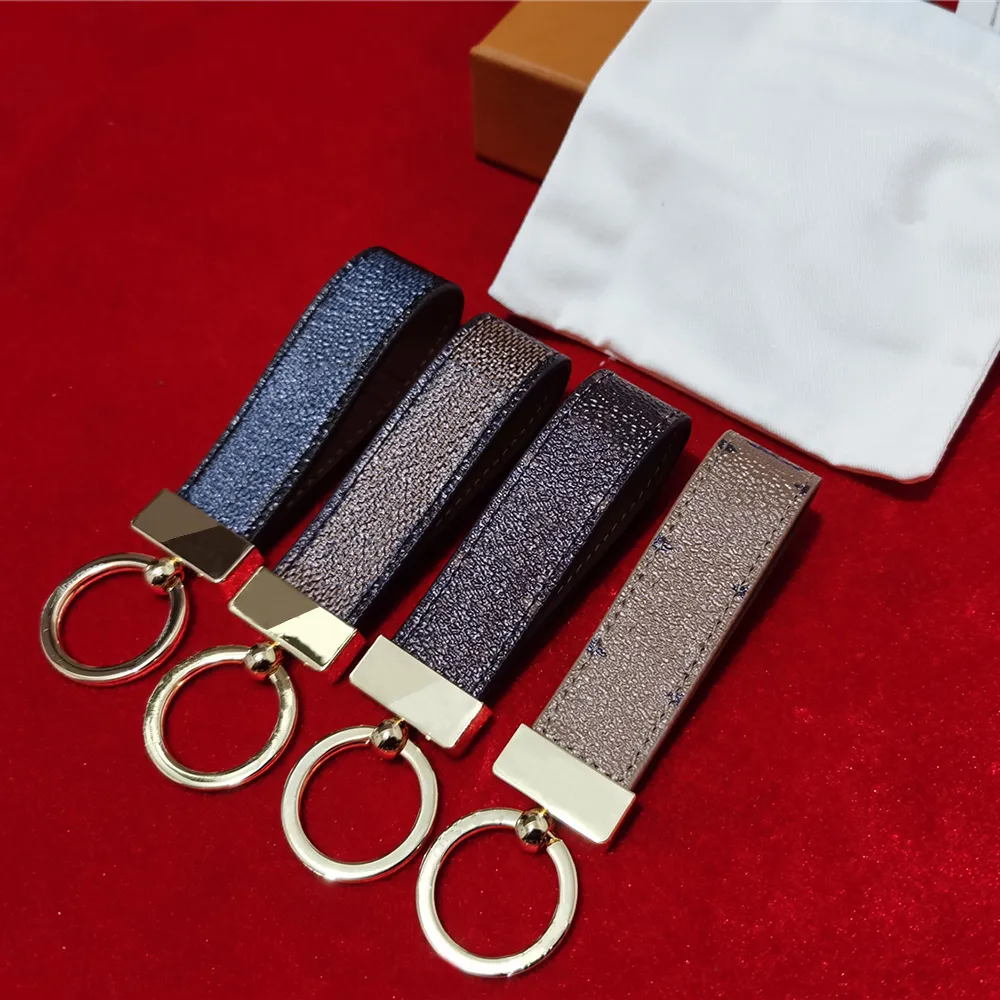 Porte-clés en cuir porte-cartes exquis luxe Designer porte-clés en alliage de zinc lettre unisexe longe mignon pour femmes hommes 65221 avec boîte 201v